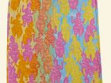 a close up of a colorful skirt with flowers on it