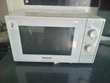 a microwave that is sitting on a counter in a kitchen