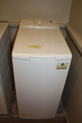 a white washer and a dryer in a small room
