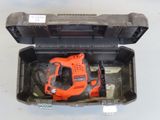 a black and decker electric drill in a tool box