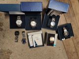 a lot of watches that are sitting on the floor