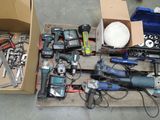 a box full of power tools and tools on the floor