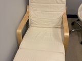 a white chair and a white chair in a room