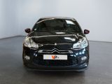 the front of a black citrole parked in a white room