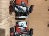 two electric tools are sitting on a wooden surface next to a box