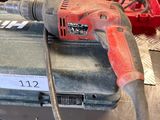 an image of a drill on a workbench in a garage