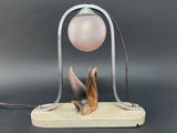 an image of a lamp that is on a stand with a light