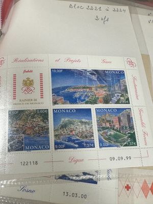 a picture of some stamps and a pair of scissors on a table