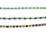 four different colored bracelets are shown on a white surface