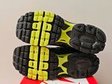 a close up of a pair of running shoes on a box