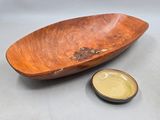 wooden bowl with a small bowl on the side and a small bowl on the other side