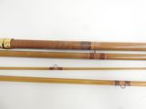 three different types of fishing rods on a white surface