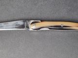 a knife that is laying on a table