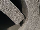a close up view of a tire with a hole in the tire