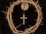 an image of a cross and crown of thorns on a black background