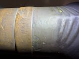 a close up of a metal pipe with some rust on it