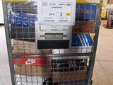 a metal cart with a bunch of items in it