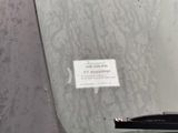 a sticker on the windshield of a car that is parked