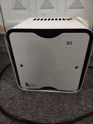 a white and black microwave oven sitting on the floor