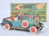 a toy car with people in it and a box in the background