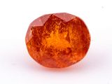 an orange diamond on a white surface with a white background