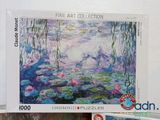 a picture of a puzzle box with a picture of water lillies