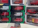 a lot of red and white firetrucks in boxes