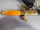 a knife that is laying on top of a bag