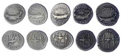 several different types of coins are shown on a white surface