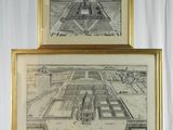 two framed pictures of a large building on a stand