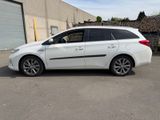 a picture of a white car parked in a parking lot
