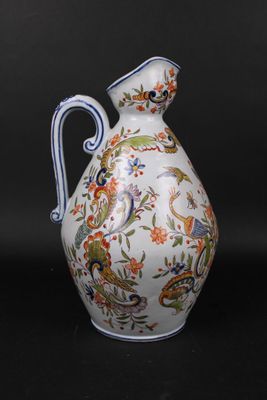 a white and blue vase with a floral design on it