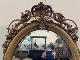a woman taking a selfie in front of a mirror