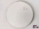 a white plate with a drawing on it on the wall