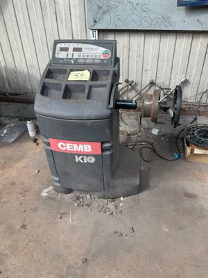 a trash can sitting next to a trash can in a garage