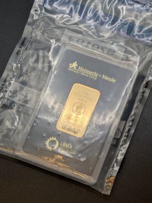 a gold bar in a plastic bag on a table