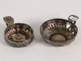 pair of silver plated bowls with spoons on a white surface