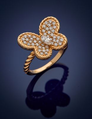 a gold and diamond flower ring, by van cleef