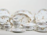 a group of porcelain dishes and cups and saucers