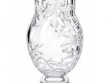 a clear glass vase with a floral design on it