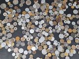a lot of coins that are on the table