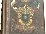 an old book with a coat of arms on it