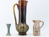 three vases that are sitting next to each other on a table