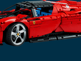 a red car made out of legos on a blue background