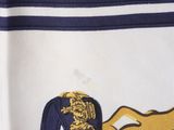 a close up of a scarf with a horse on it