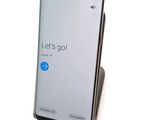 a cell phone that is sitting on top of a stand