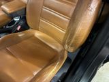 a close up of a brown leather seat in a car
