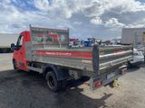 a red truck that is parked in the parking lot