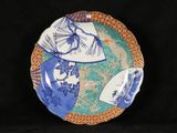 a blue and white plate with a design on it