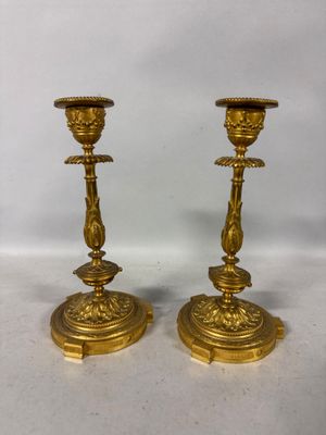pair of antique brass candlesticks on marble bases